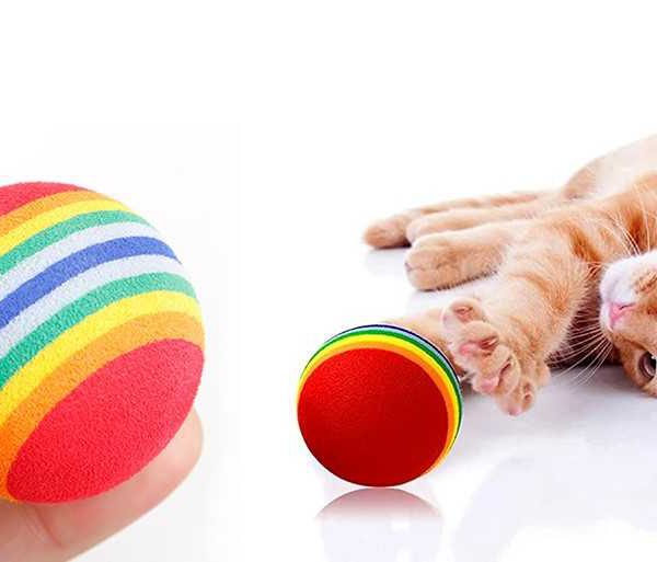 تصویر توپ رنگین کمان و پلاستیکی جغجغه ای